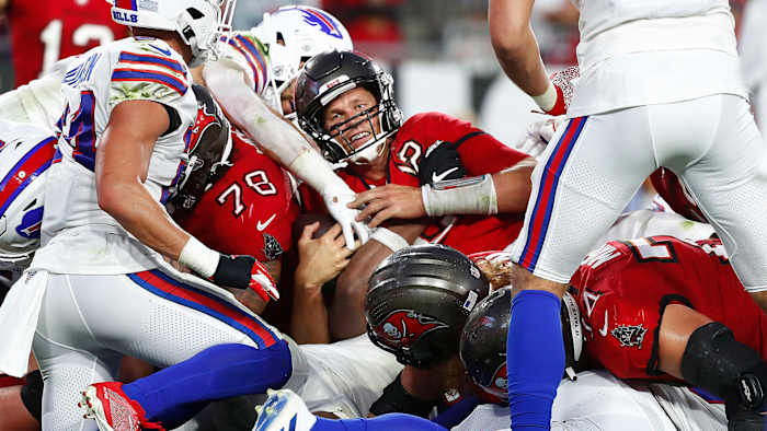 Tom Brady smiles while sneaking the ball into the end zone for a touchdown against the Bills